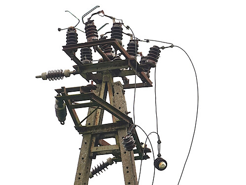 photo showing derelict medium voltage power pole (license notice embedded in JPG file)